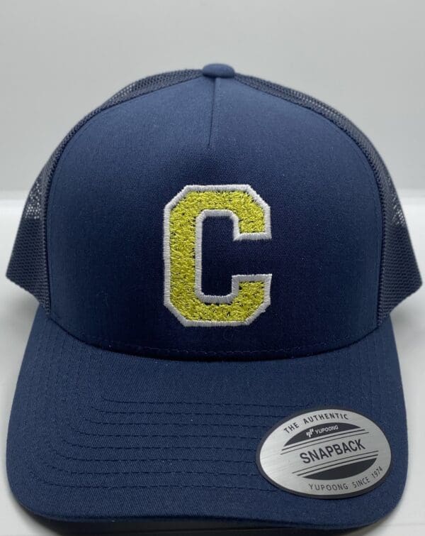 A blue hat with the letter c on it.