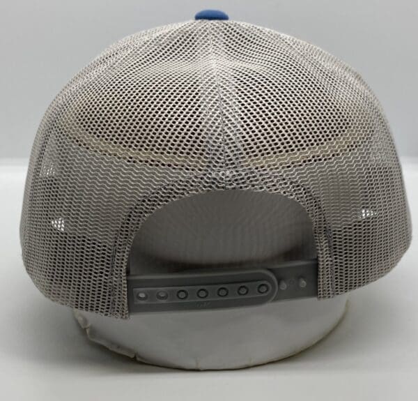 A white hat with a blue and grey mesh back.