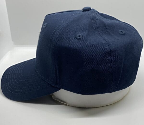 A baseball cap is shown on top of a table.