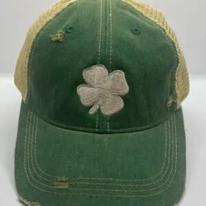 A green hat with a white clover on it.