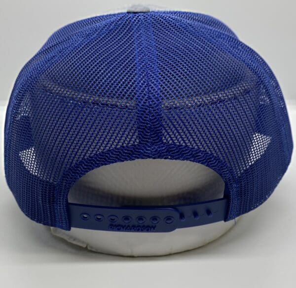 A blue and white hat with a blue mesh back.