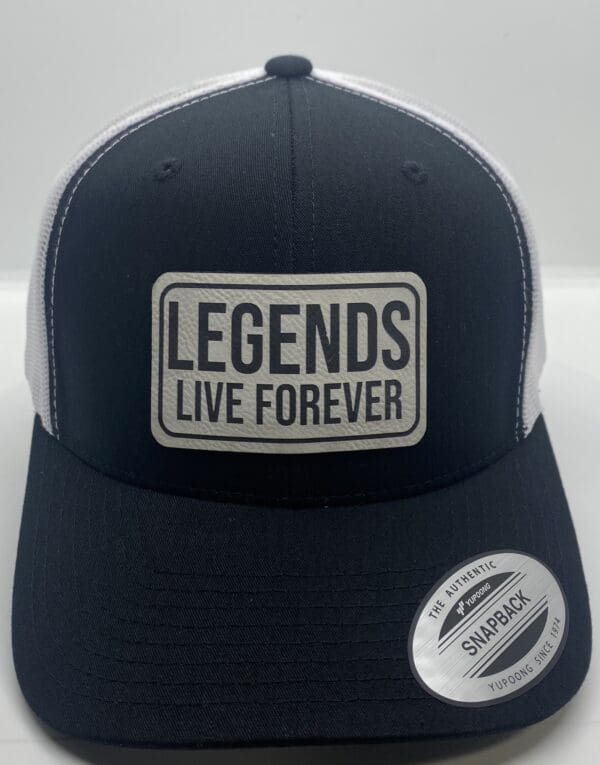 A black and white hat with the words legends live forever on it.