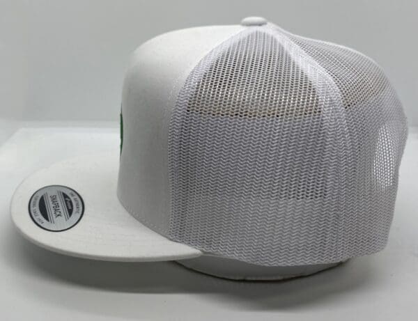 A white hat with a patch on the side of it.