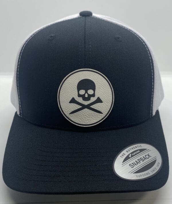 A black and white hat with a skull on it