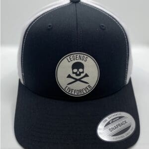 A black and white hat with a skull patch on it