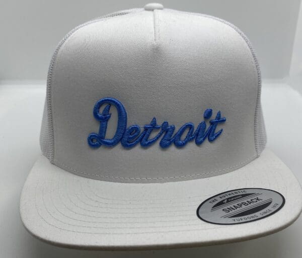 A white hat with the word detroit on it.