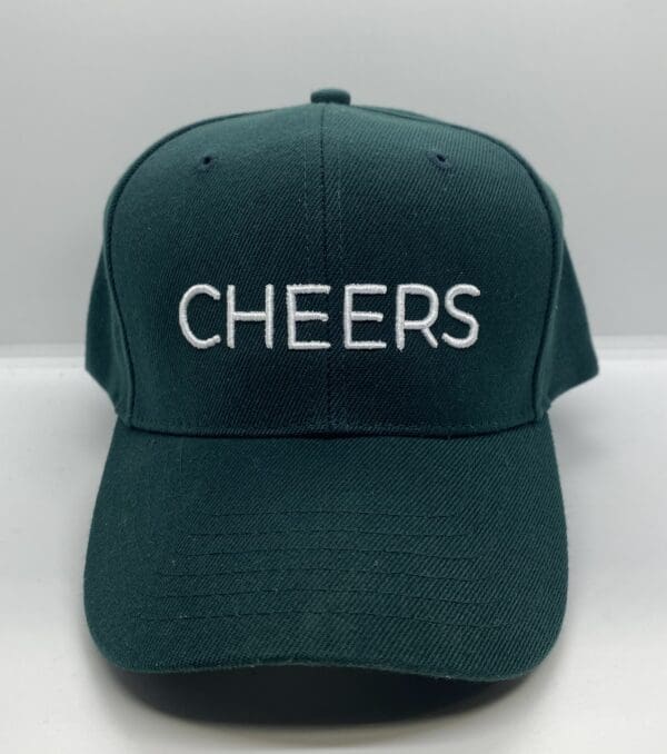 Green cap with "CHEERS" embroidered text.